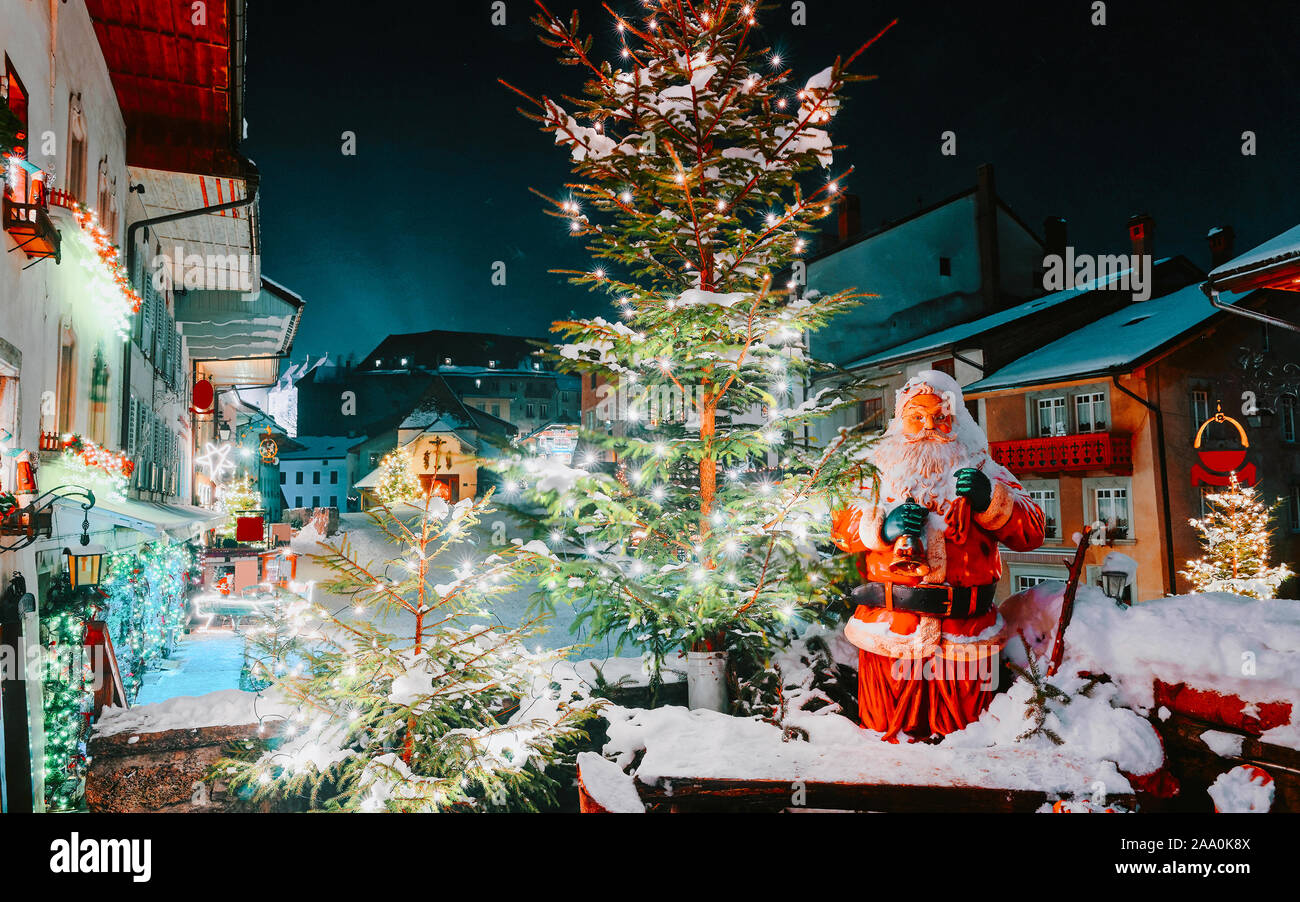 Santa Claus and Christmas tree in Gruyeres winter night new Stock Photo