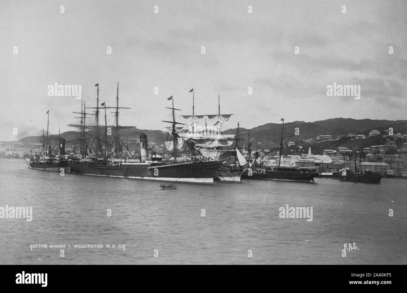Black and white landscape photograph of ships at the Queens Wharf, Lambton Harbour in Wellington, New Zealand, by photographer Frank Coxhead, 1885. From the New York Public Library. () Stock Photo