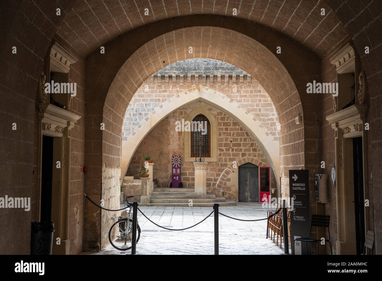 View through entrance to courtyard of Castello de’ Monti in Corigliano d'Otranto, Apulia (Puglia) in Southern Italy Stock Photo