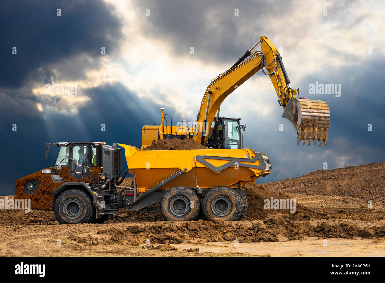 Excavator on a construction site Stock Photo - Alamy