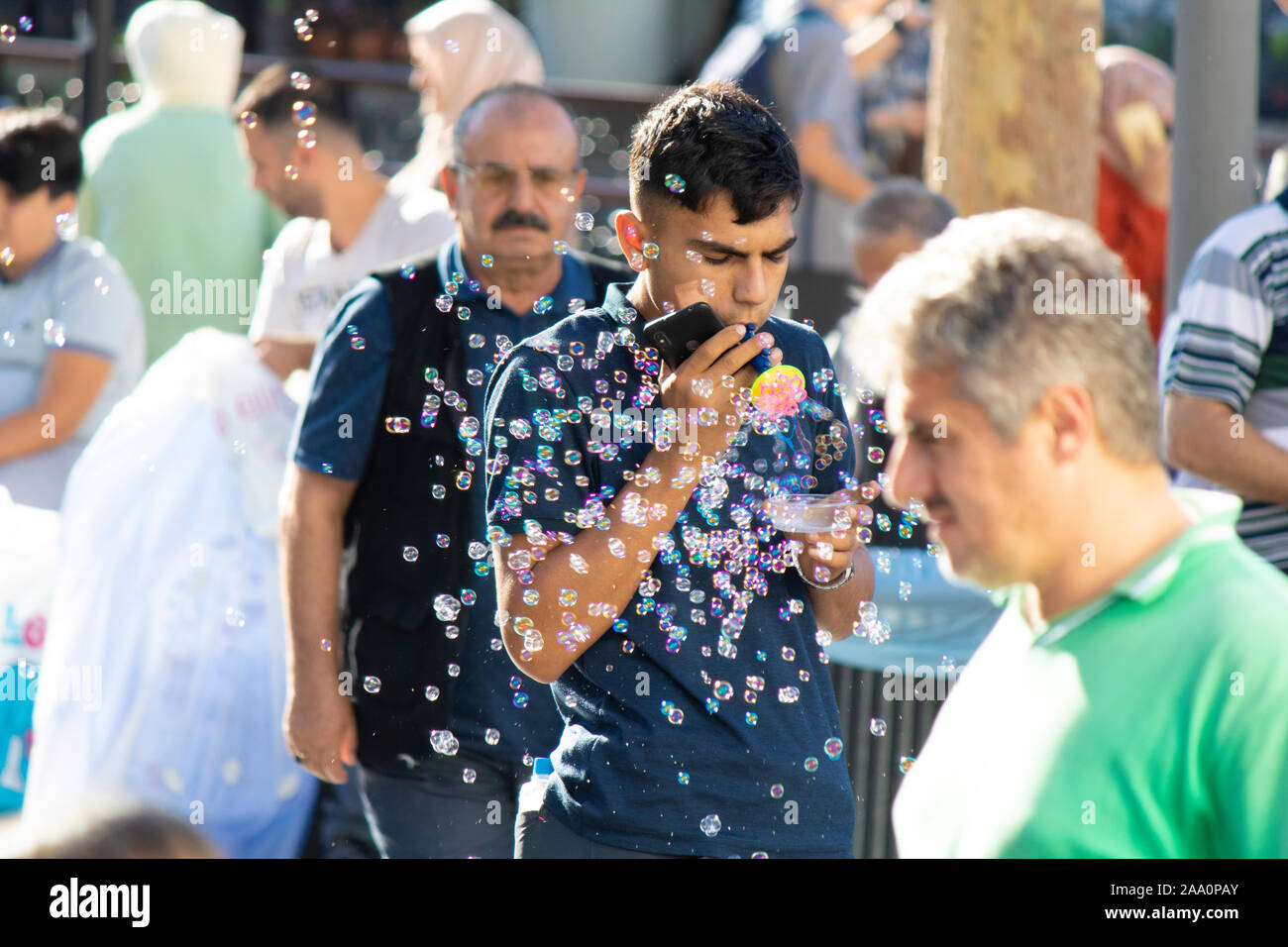 Istanbul, Turkey - September-28.2019: Child worker in Istanbul selling soap bubble machine Stock Photo