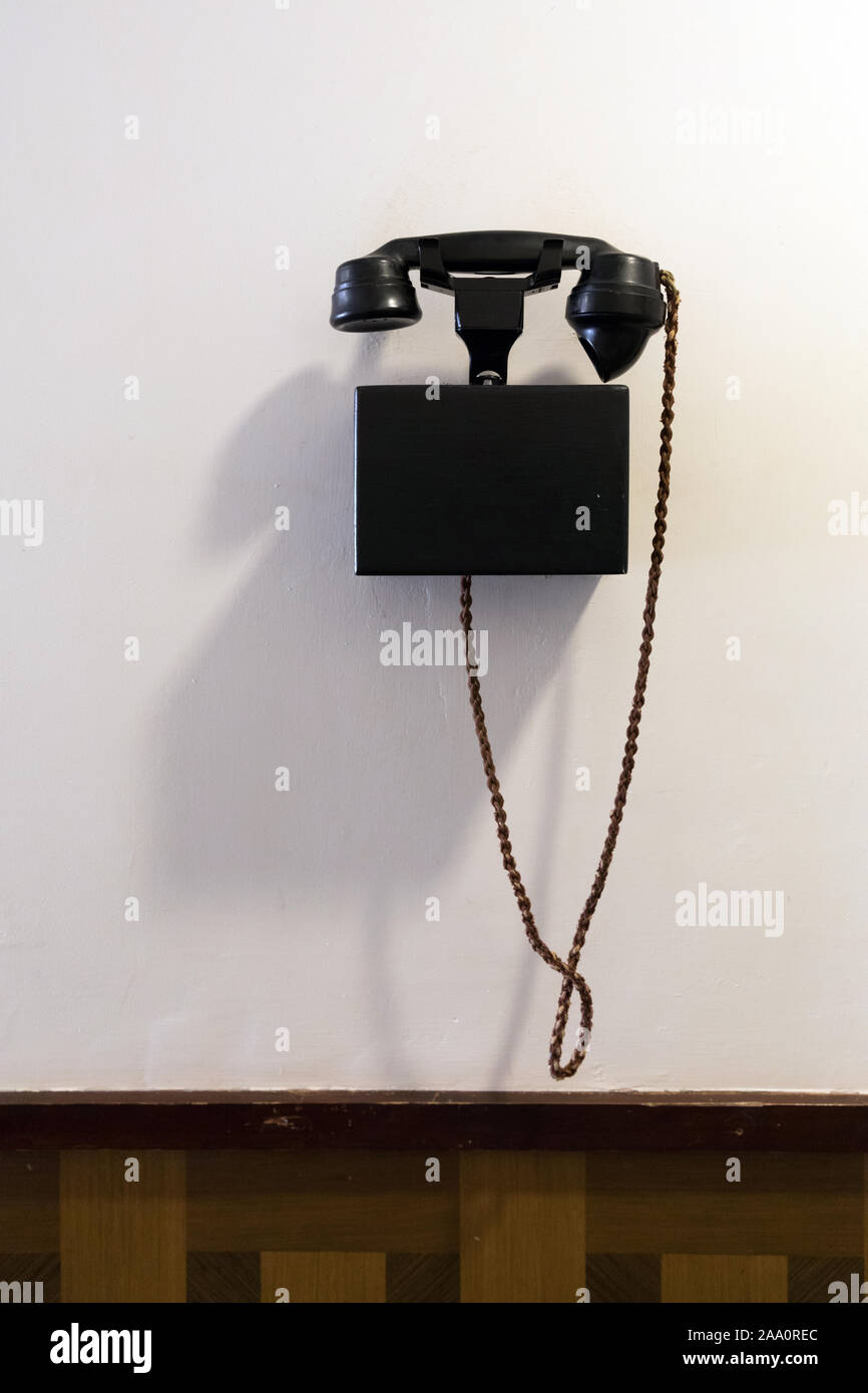 Old fashioned wall mounted telephone Stock Photo