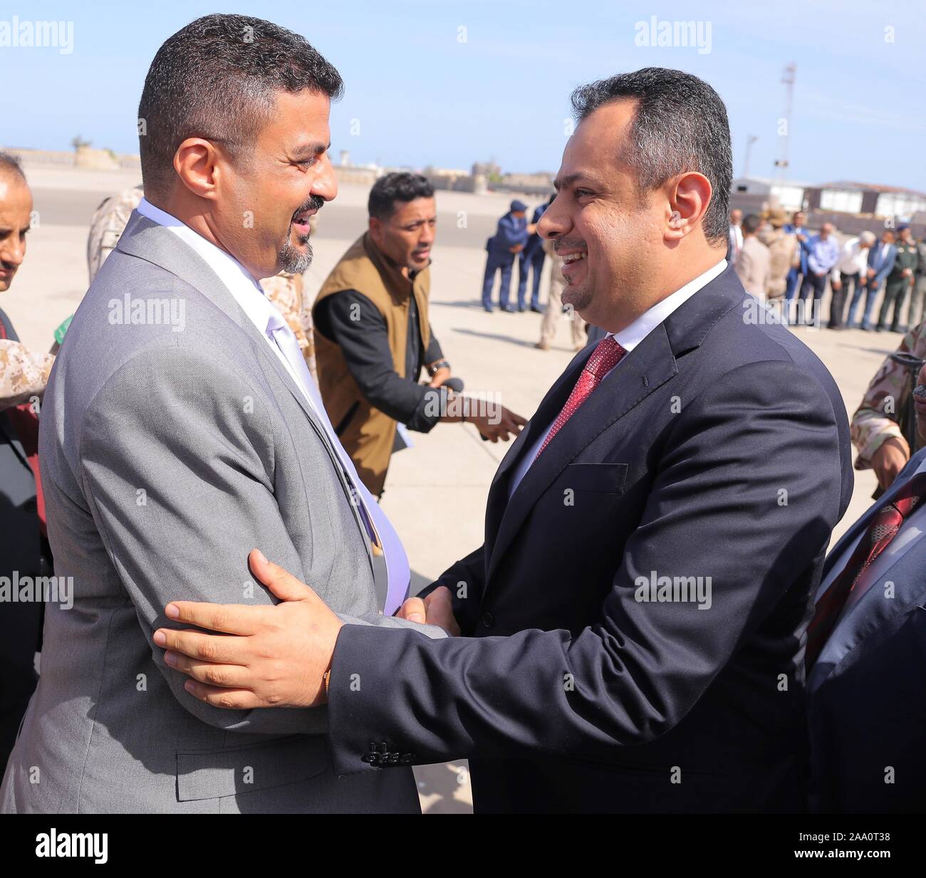Aden. 18th Nov, 2019. Yemen's Prime Minister Maeen Abdulmalik (R) shakes hands with a local government official at Aden's International Airport, Yemen, on Nov. 18, 2019. Yemen's Prime Minister Maeen Abdulmalik and other ministers and government officials arrived on Monday in the country's southern port city of Aden. Credit: Xinhua/Alamy Live News Stock Photo