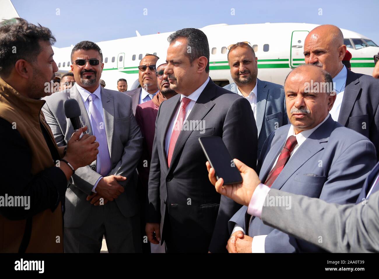 Aden. 18th Nov, 2019. Yemen's Prime Minister Maeen Abdulmalik (C) is interviewed upon his arrival at Aden's International Airport, Yemen, on Nov. 18, 2019. Yemen's Prime Minister Maeen Abdulmalik and other ministers and government officials arrived on Monday in the country's southern port city of Aden. Credit: Xinhua/Alamy Live News Stock Photo