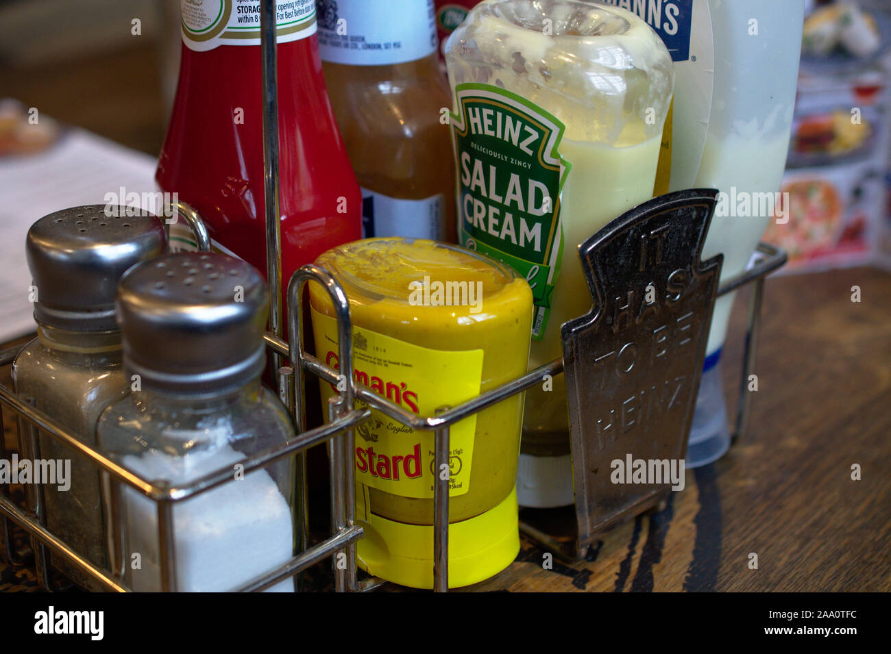 Aberystwyth Ceredigion/UK November 11 2019: Food condiments in a carry cage on a table in a wetherspoons pub Stock Photo