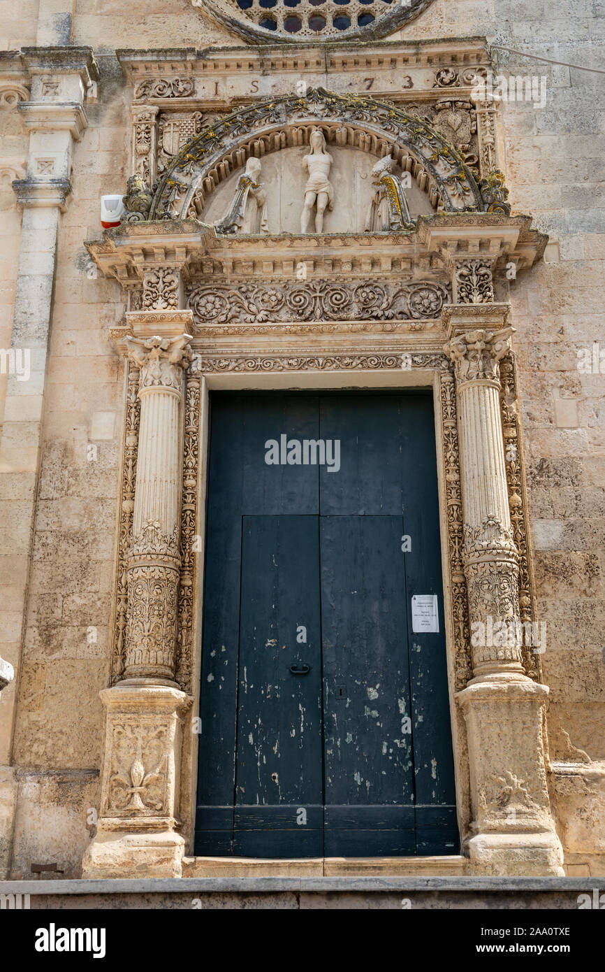 Entrance to Chiesa di San Nicola Vescovo in Corigliano d'Otranto, Apulia (Puglia) in Southern Italy Stock Photo