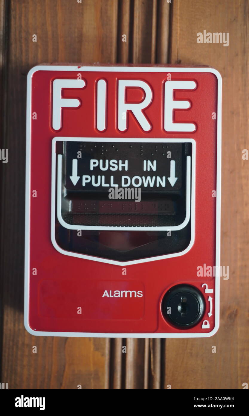 Fire Alarm station with Push In Pull Down label and key lock on wooden