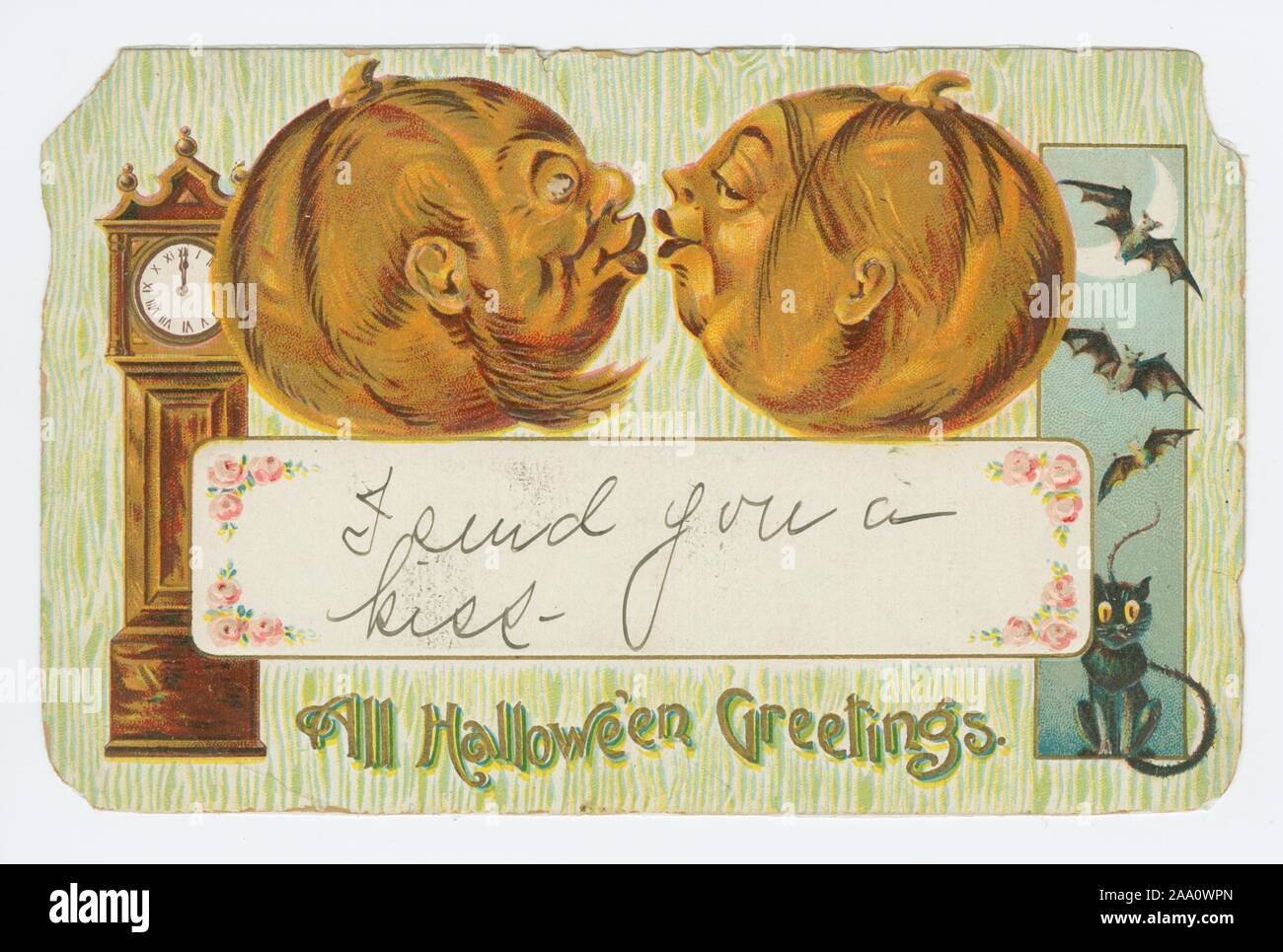 Illustrated postcard titled 'All Hallowe'en Greetings' featuring an illustration of two Halloween pumpkins kissing, with a grandfather clock on the left and a black cat and three bats on the right, published by Dreyfuss and Davis Gottschalk, 1908. From the New York Public Library. () Stock Photo