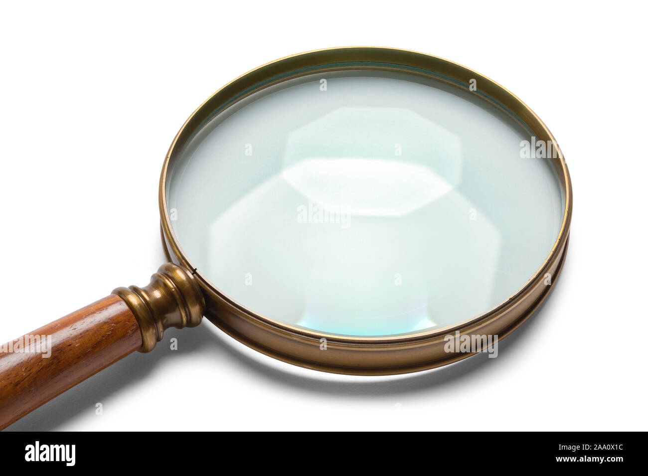 Brass Magnifying Glass with Wood Handle Close Up Isolated on White Background. Stock Photo