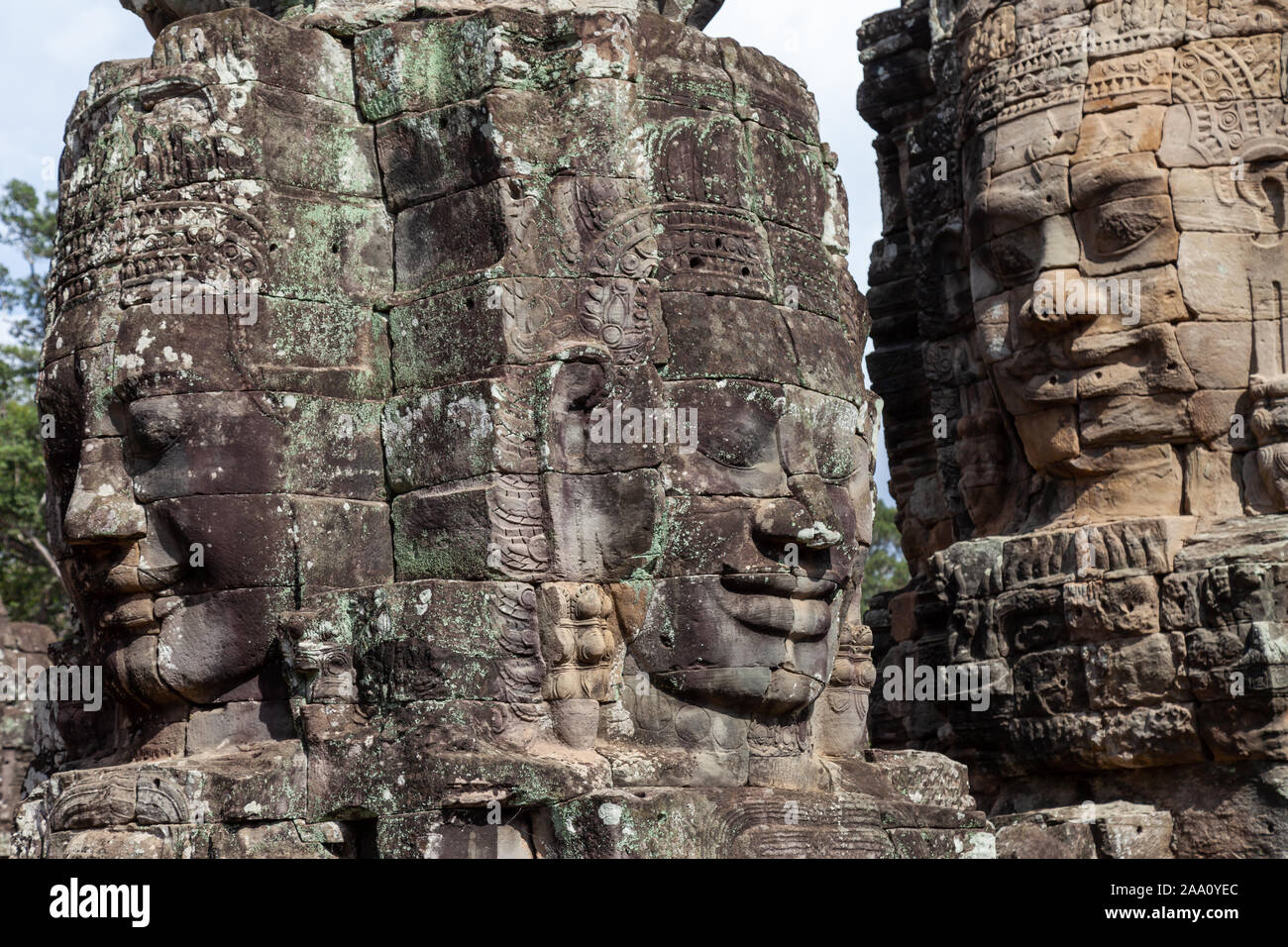 Faces of Bayon Temple, Siem Reap, Cambodia. This temple is famous for its variety of different Buddah faces. They are in pristine condition and rank a Stock Photo