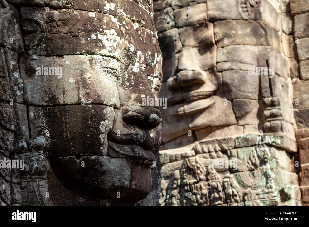 Faces of Bayon Temple, Siem Reap, Cambodia. This temple is famous for its variety of different Buddah faces. They are in pristine condition and rank a Stock Photo