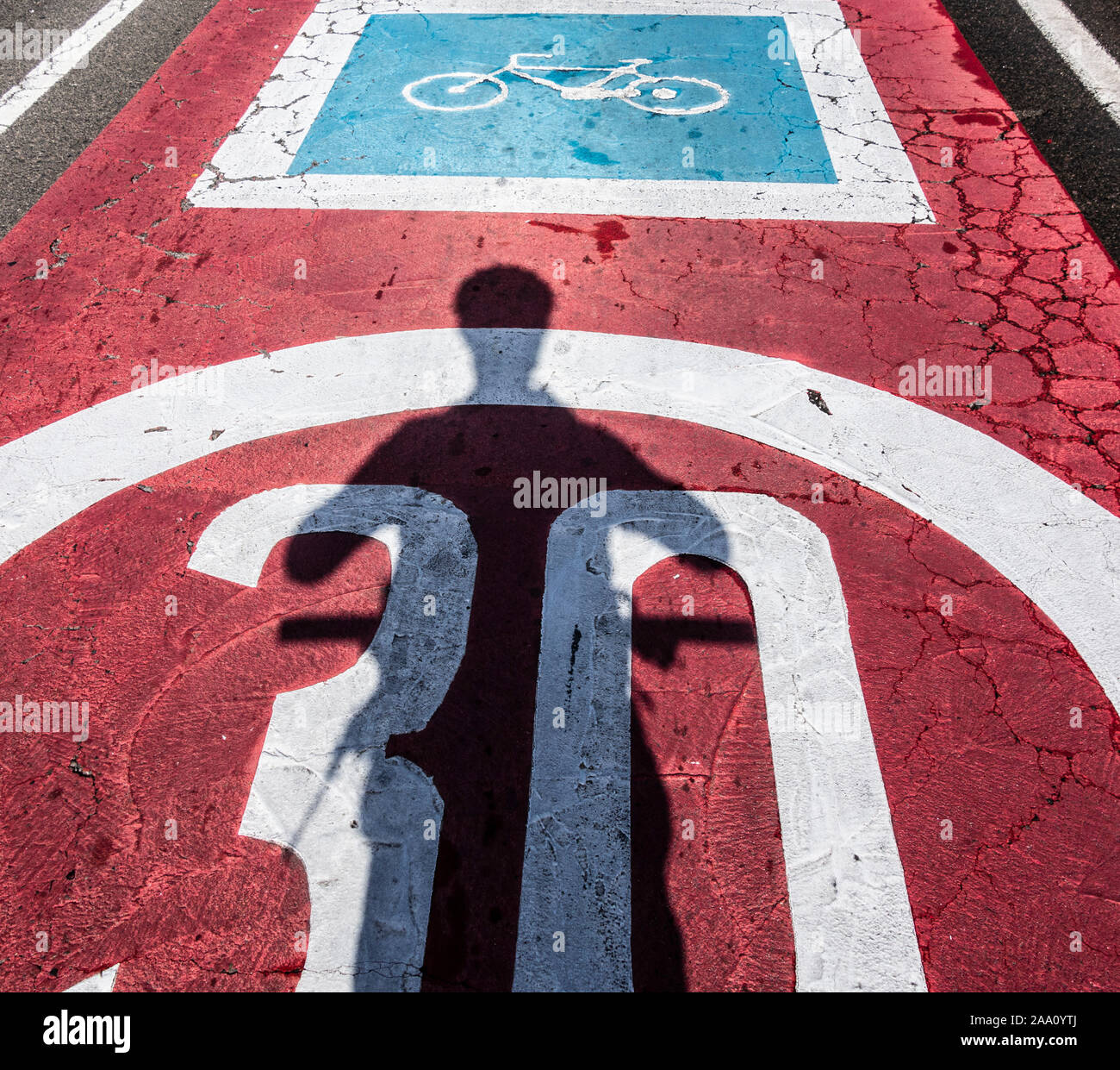 Road markings warning motorists that road is also used by cyclists. Stock Photo