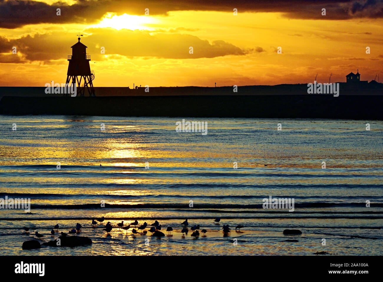 South Shields Herd Sand historic lighthouse at dawn on Tyne estuary Stock Photo