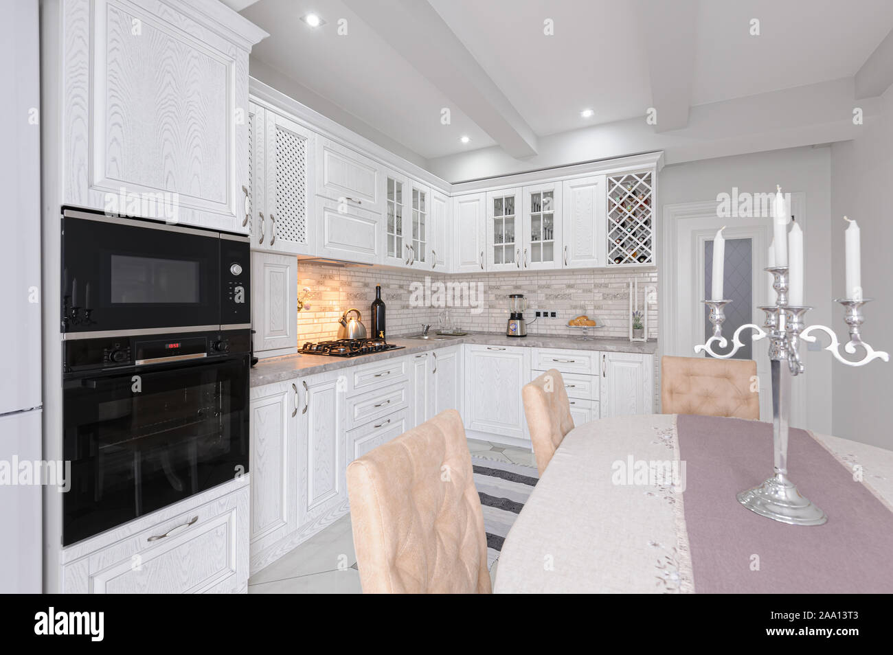 modern white wooden kitchen interior Stock Photo - Alamy