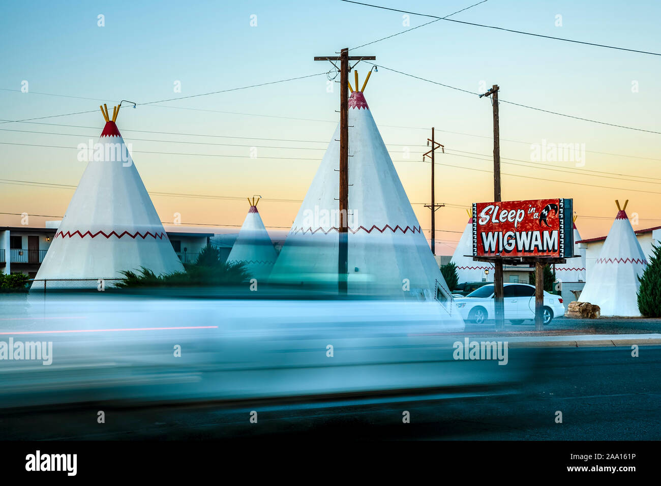 Teepees/wigwams and streaking car, Wigwam Motel, Route 66, Holbrook, Arizona USA Stock Photo