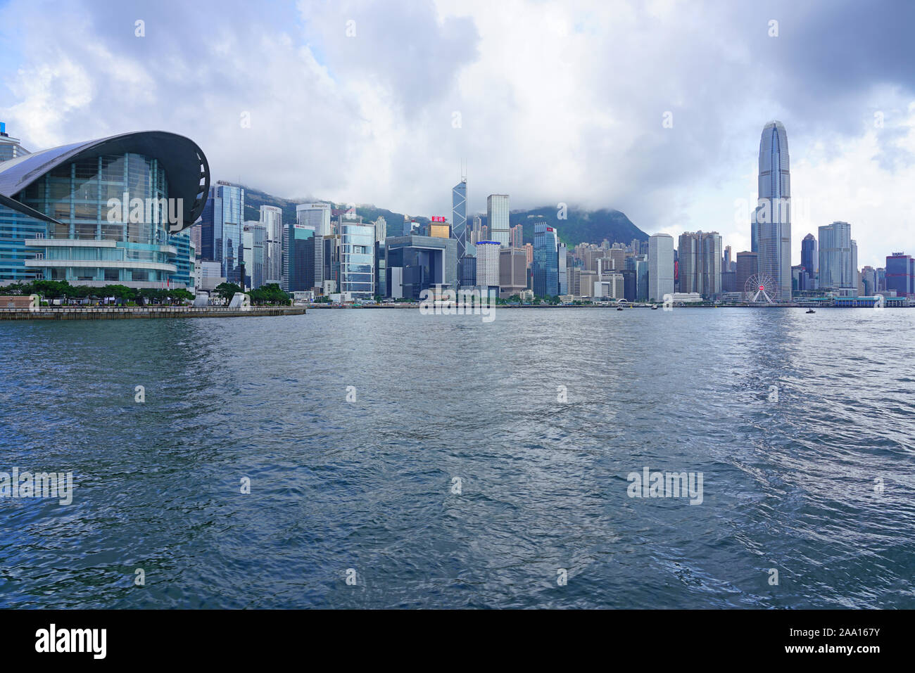HONG KONG -29 JUN 2019- Day view the modern Hong Kong skyline near the Convention Center in Wan Chai as seen from the water in  Victoria Harbor. Stock Photo