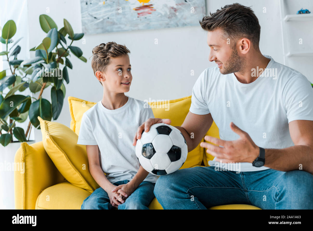 Father son looking plant hi-res stock photography and images - Alamy