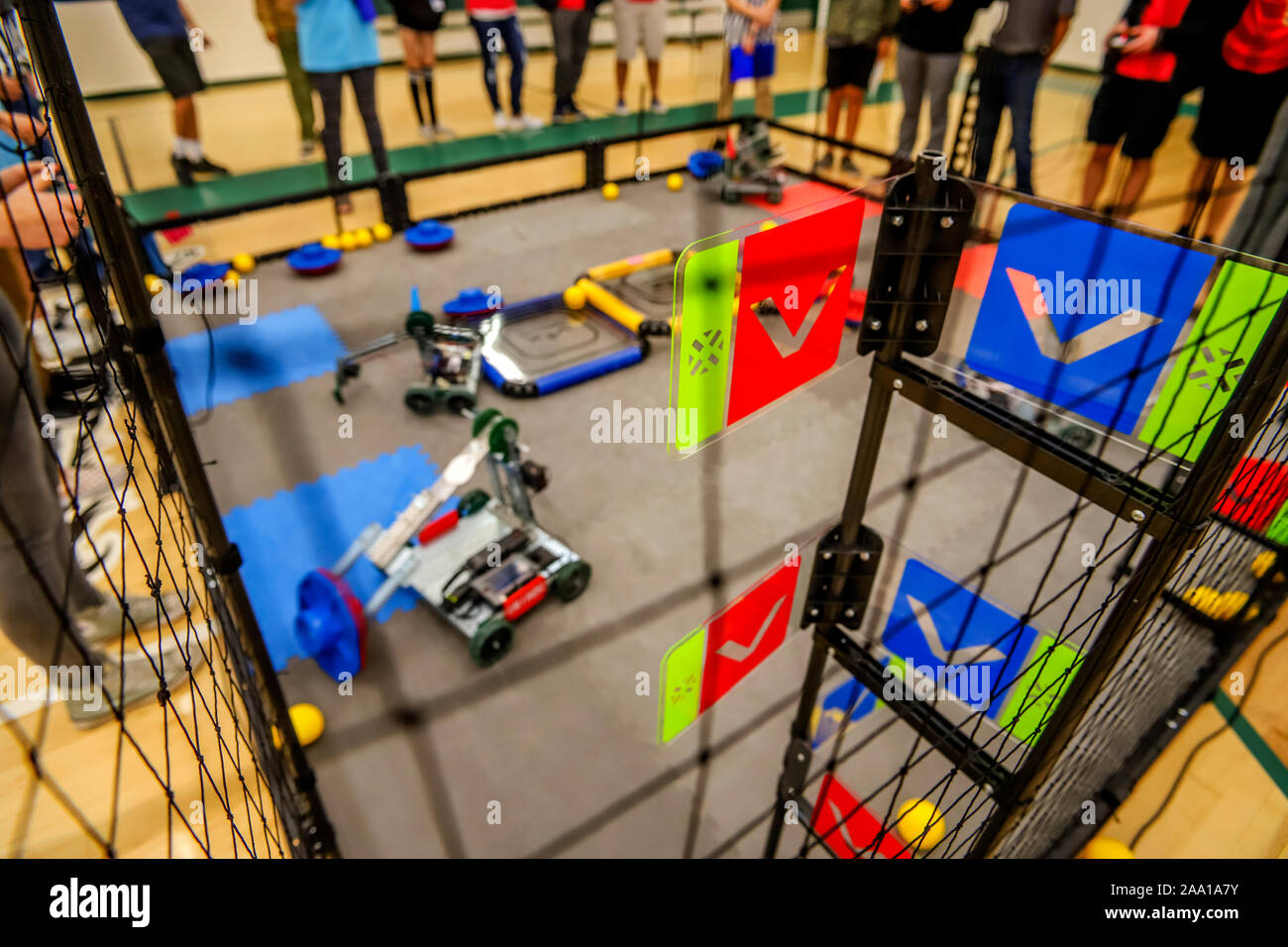 Using their mechanical arms, remote controlled robots perform ritualized tasks in the Turning