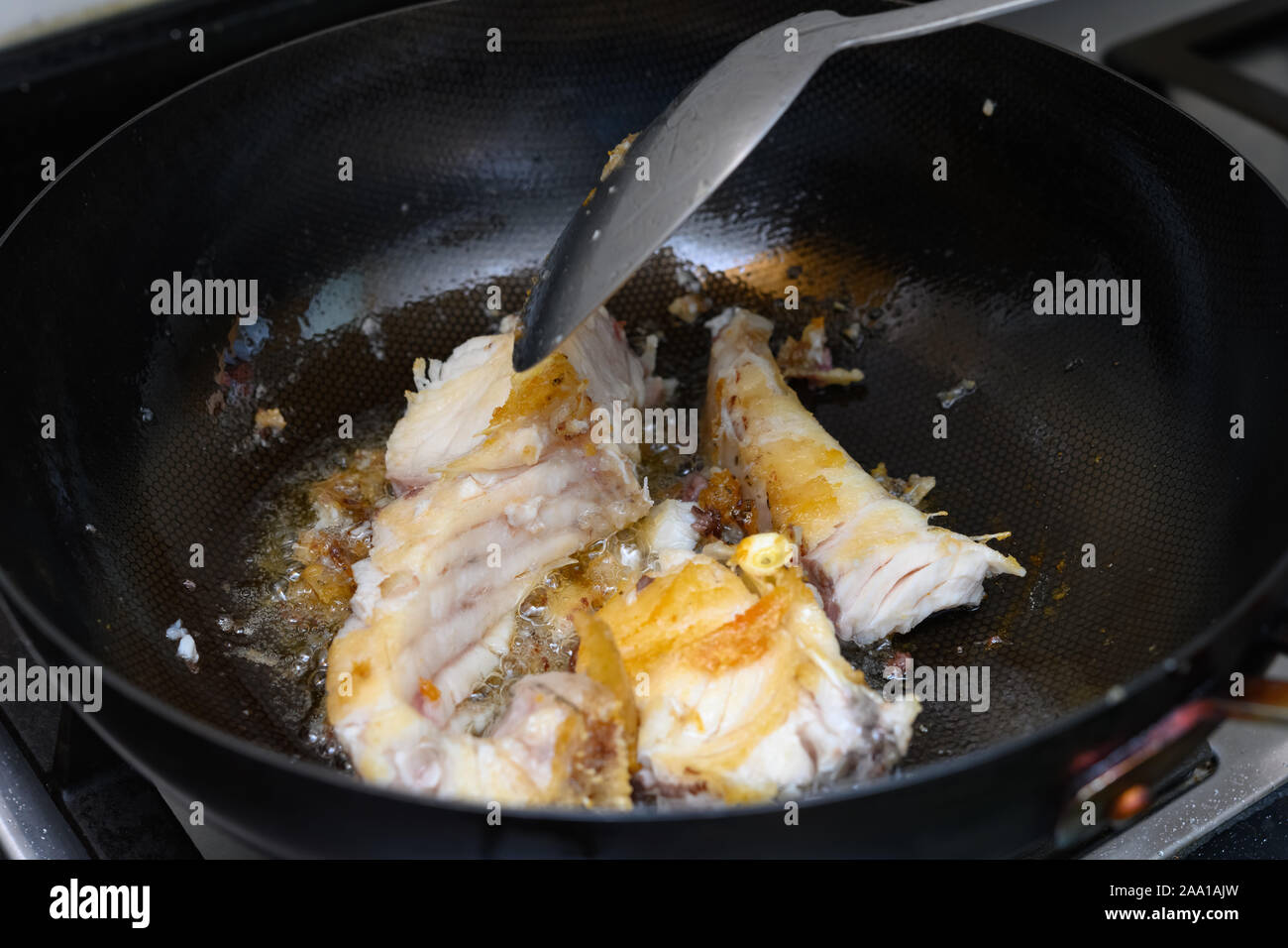frying fresh fish on a pan at home Stock Photo - Alamy