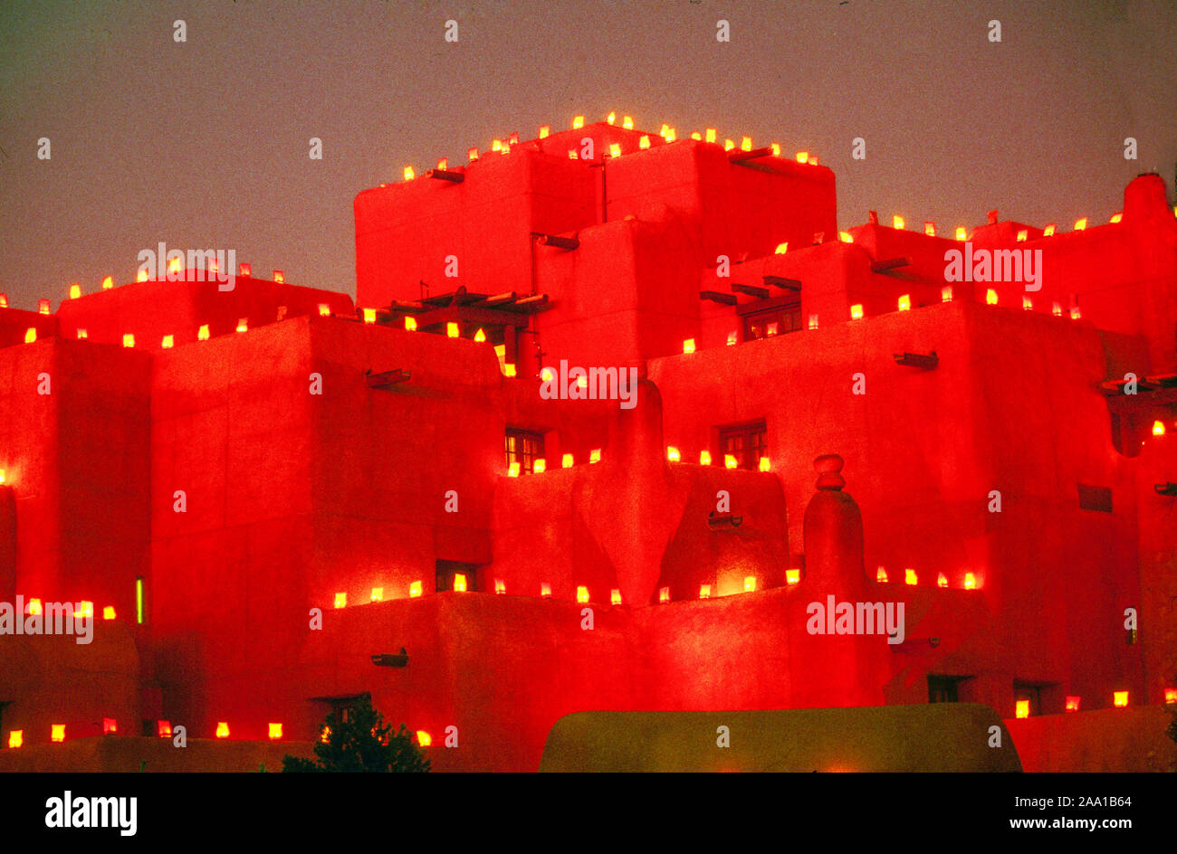 Farolito Christmas lights decorate an adobe building in Santa Fe, NM. Stock Photo