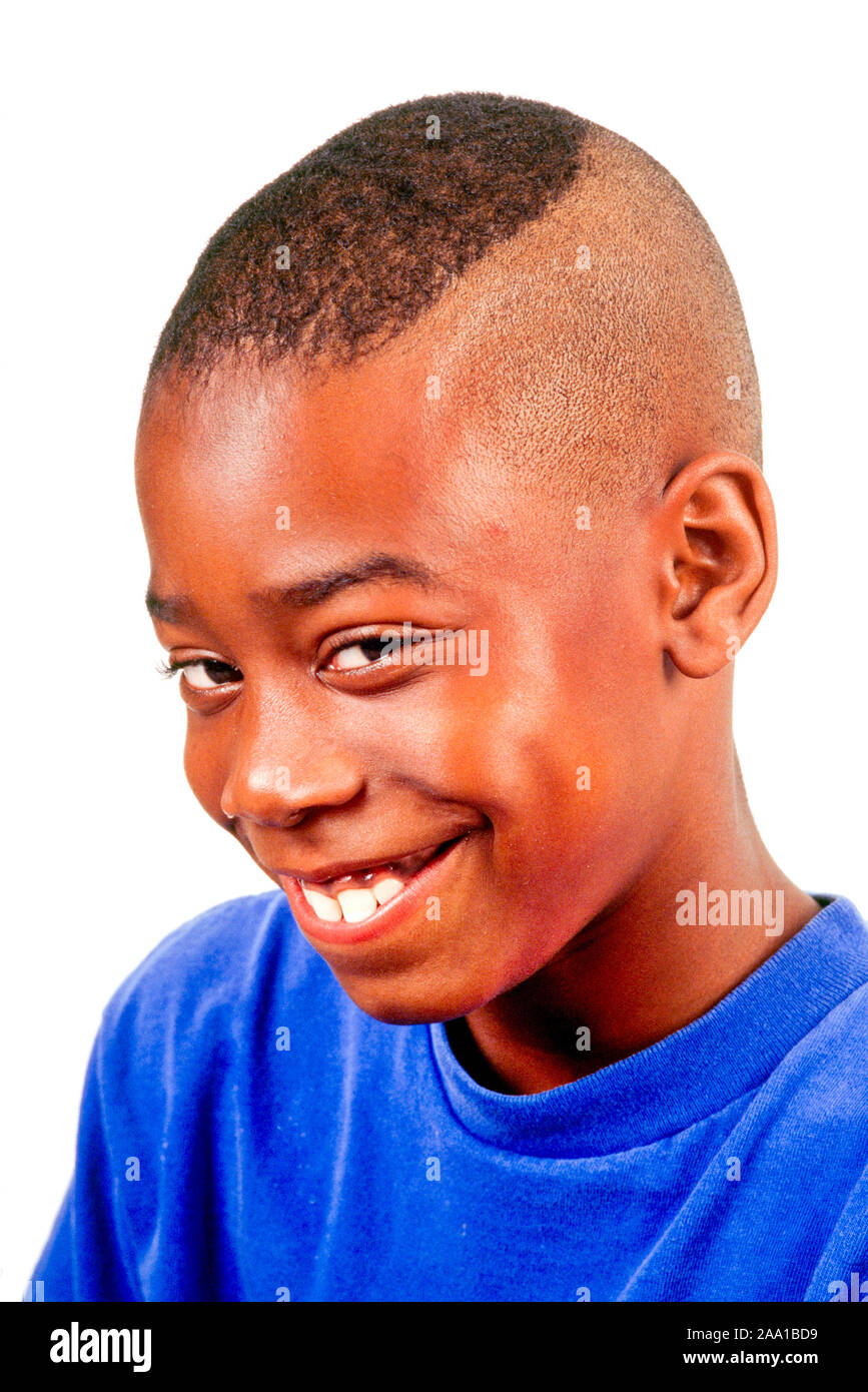 A 10yearold African American boy poses with a shy smile in Corona, CA