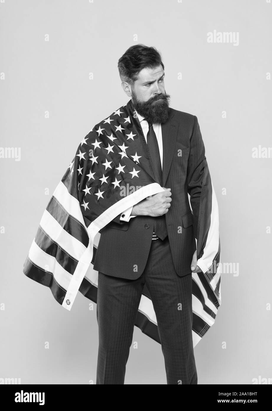 Businessman bearded man in formal suit hold flag USA. Businessman concept. Successful businessman lawyer or politician. Business people. Independence means decide according to law and facts. Stock Photo
