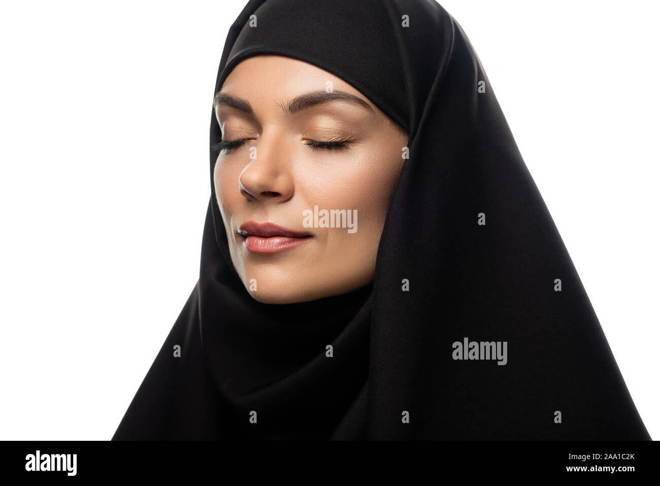 attractive young Muslim woman in hijab with closed eyes isolated on ...