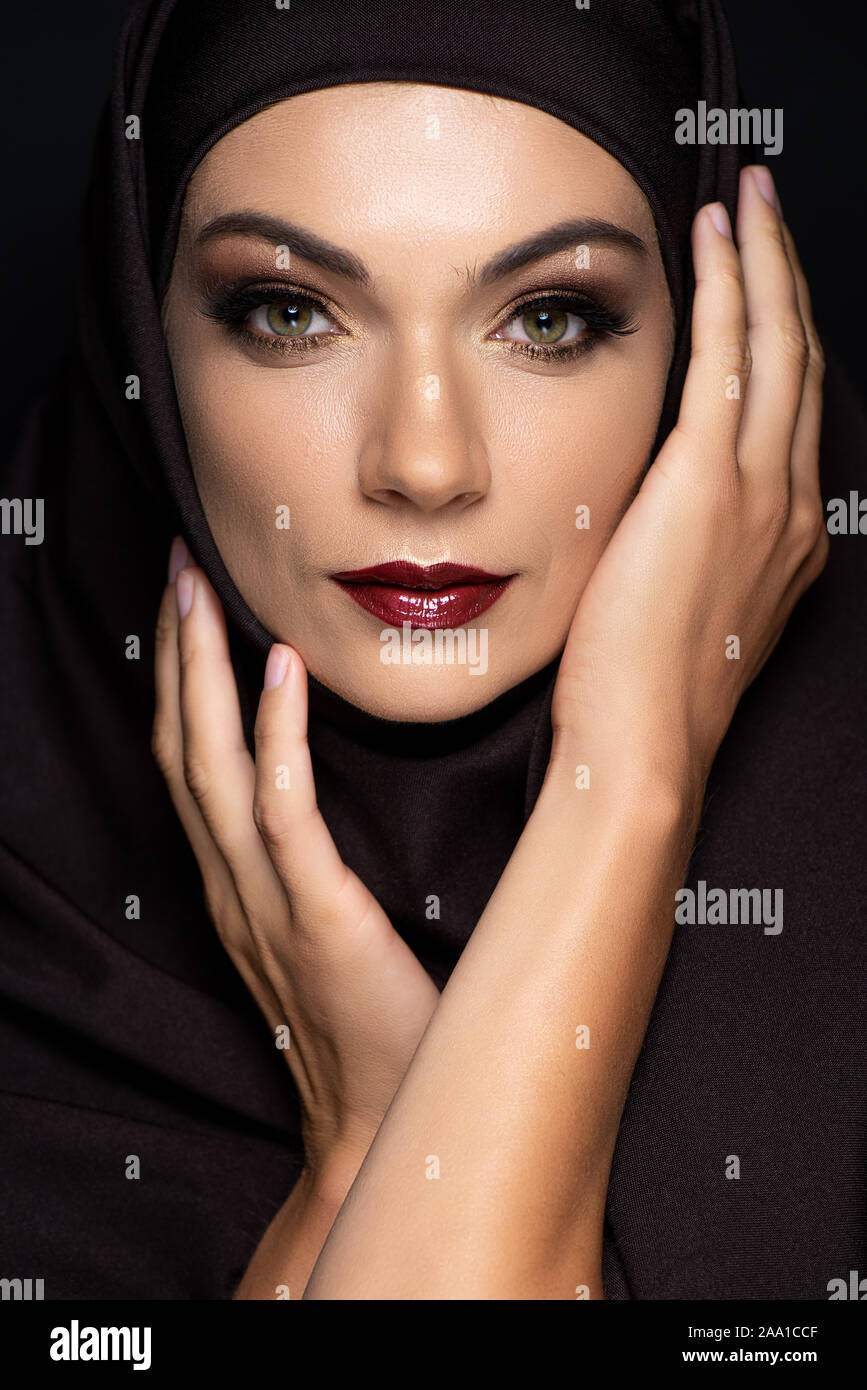 young Muslim woman in hijab with smoky eyes and red lips isolated on ...