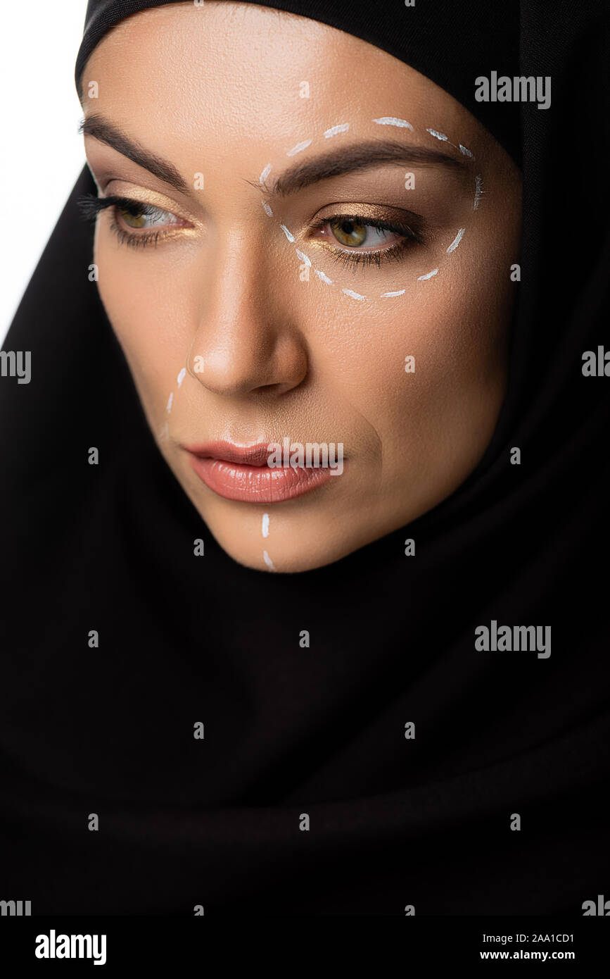 young Muslim woman in hijab with plastic surgery marks on face isolated on white Stock Photo