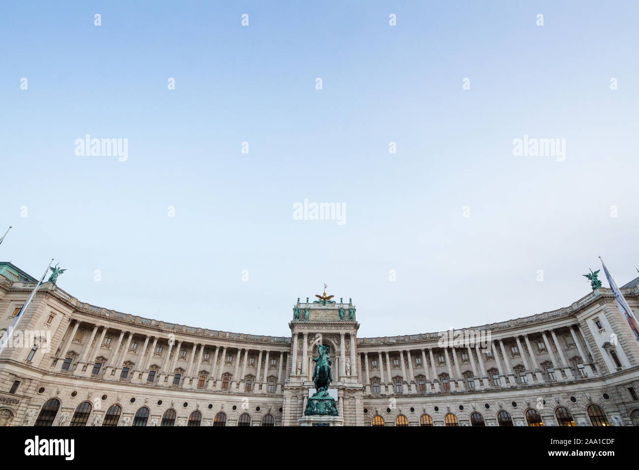 Hoffburg palace, on its Neue Burg aisle, taken from the Heldenplatz square, with the 19th century Prinz Eugen statue in front in Vienna, Austria. It i Stock Photo