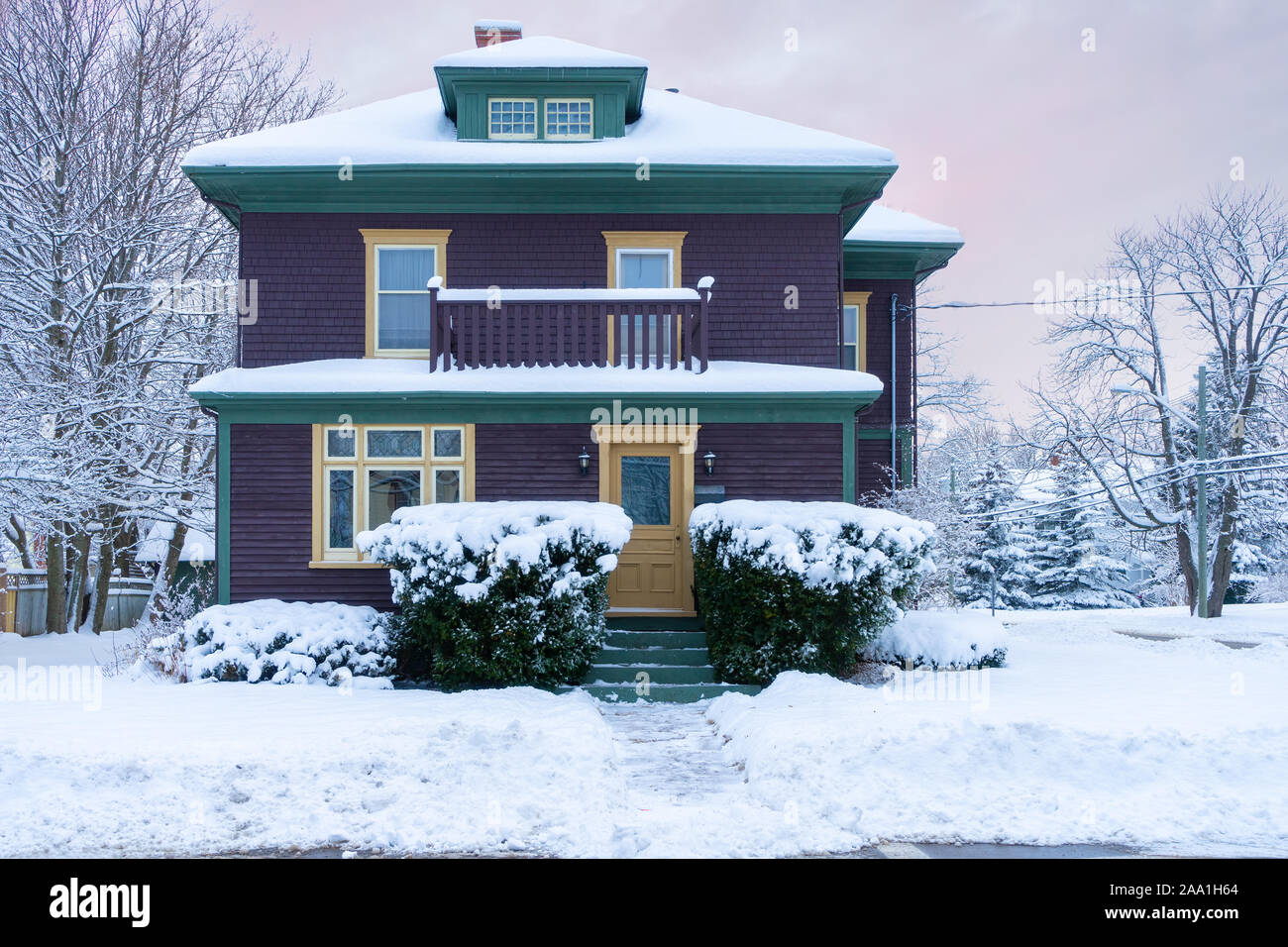 Older traditional style home after a snowfall. Stock Photo
