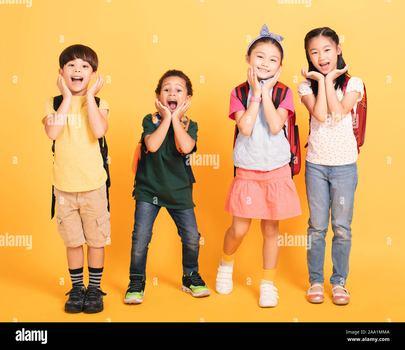 Group of happy kids standing  and yelling Stock Photo