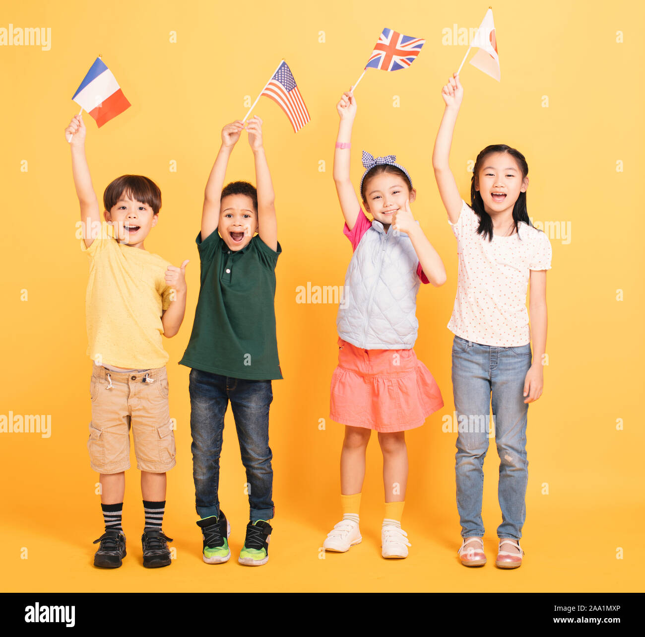 Group of happy kids showing the flags Stock Photo