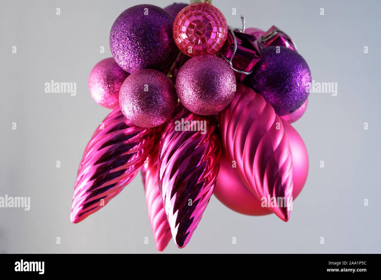 Purple, pink and red Christmas tree decorations Stock Photo