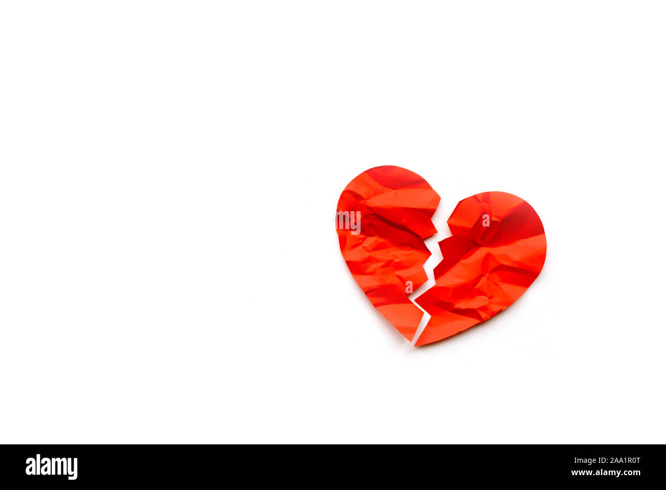 Red paper broken heart on white background Stock Photo