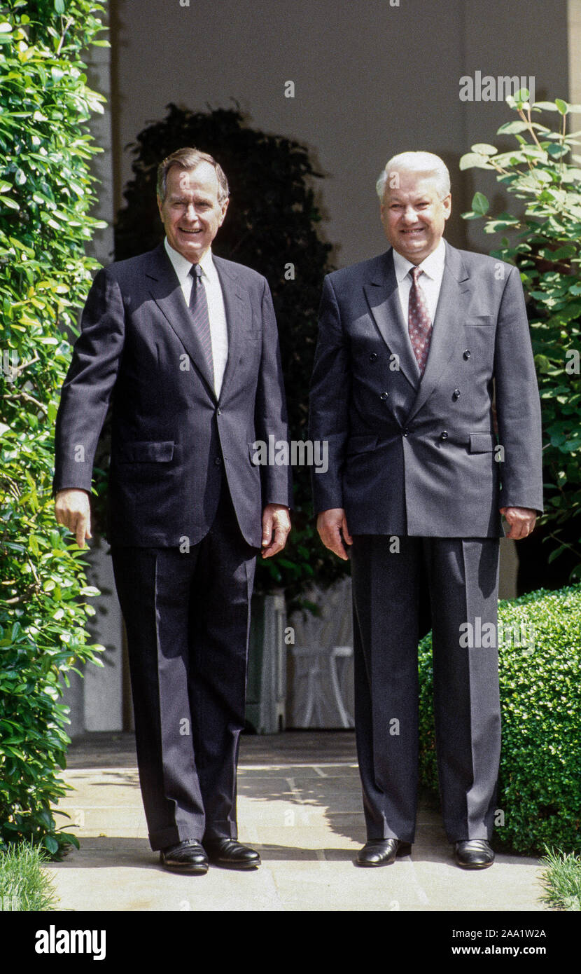 Washington DC, USA, June 16, 1992 United States  President George H.W. Bush with Russian President Boris Yeltsin during official state visit to the White House. Walking down sidewalk from Oval Office to driveway. Credit: Mark Reinstein / MediaPunch Stock Photo