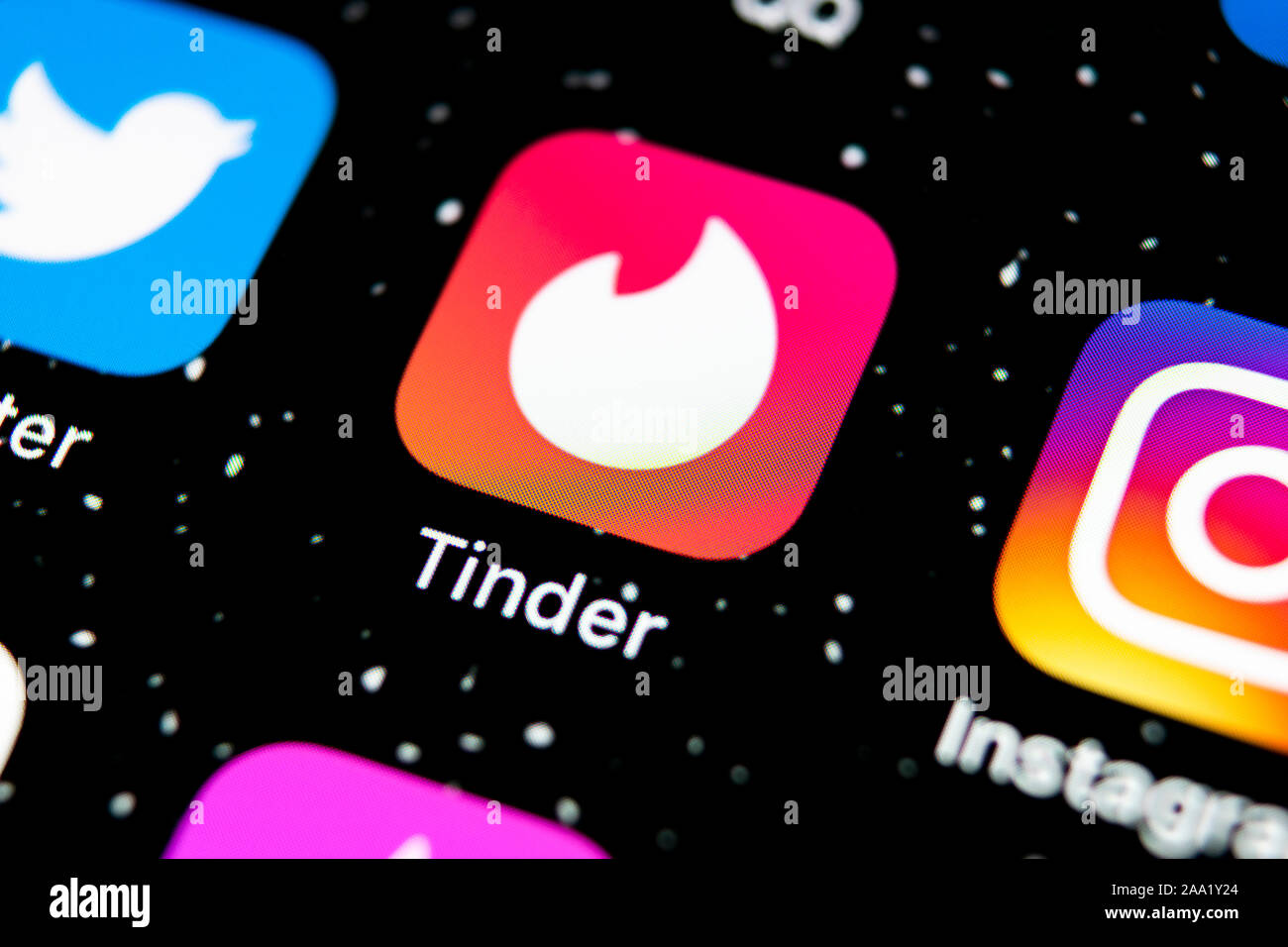 Sankt-Petersburg, Russia, February 3, 2019: Tinder application icon on Apple iPhone X screen close-up. Tinder app icon. Tinder application. Social med Stock Photo