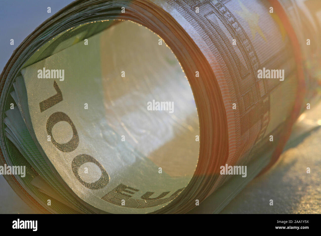 Zusammengerollte Euro Geldscheine mit einem Gummiring / Rolled Euro bank notes with a rubber ring Stock Photo