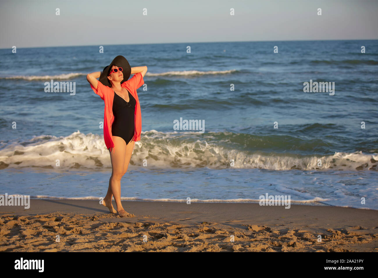 Mature Woman Sunbathing Beach High Resolution Stock Photography and