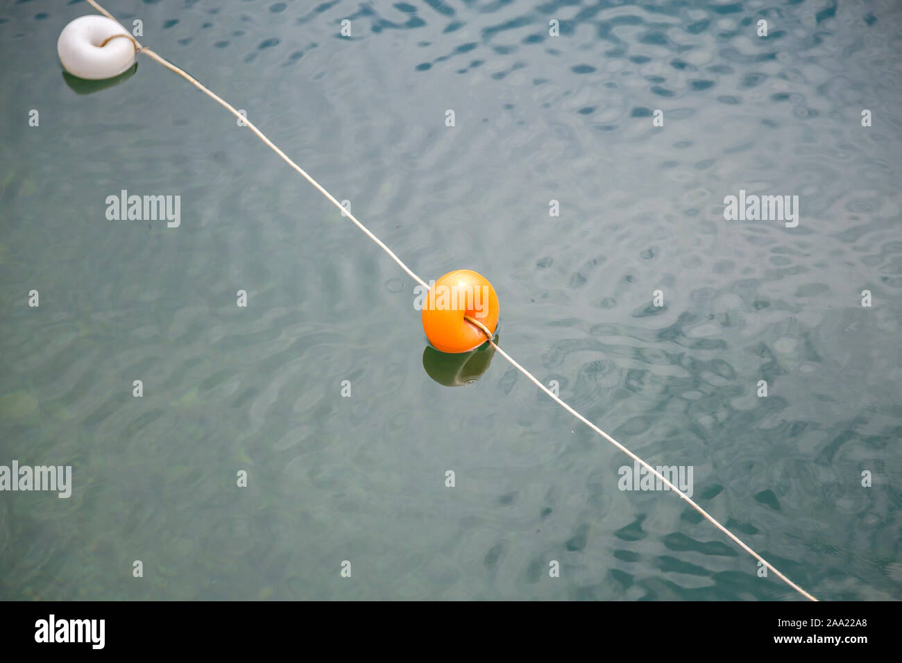 Yellow swim line buoy hi-res stock photography and images - Alamy