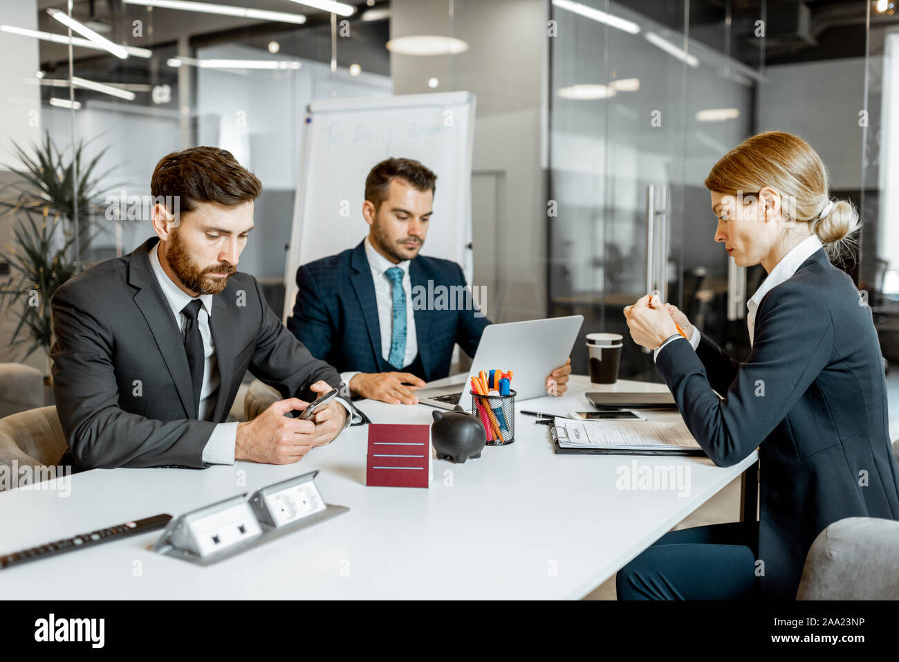 Business people sitting during a boring conference in the meeting room Stock Photo