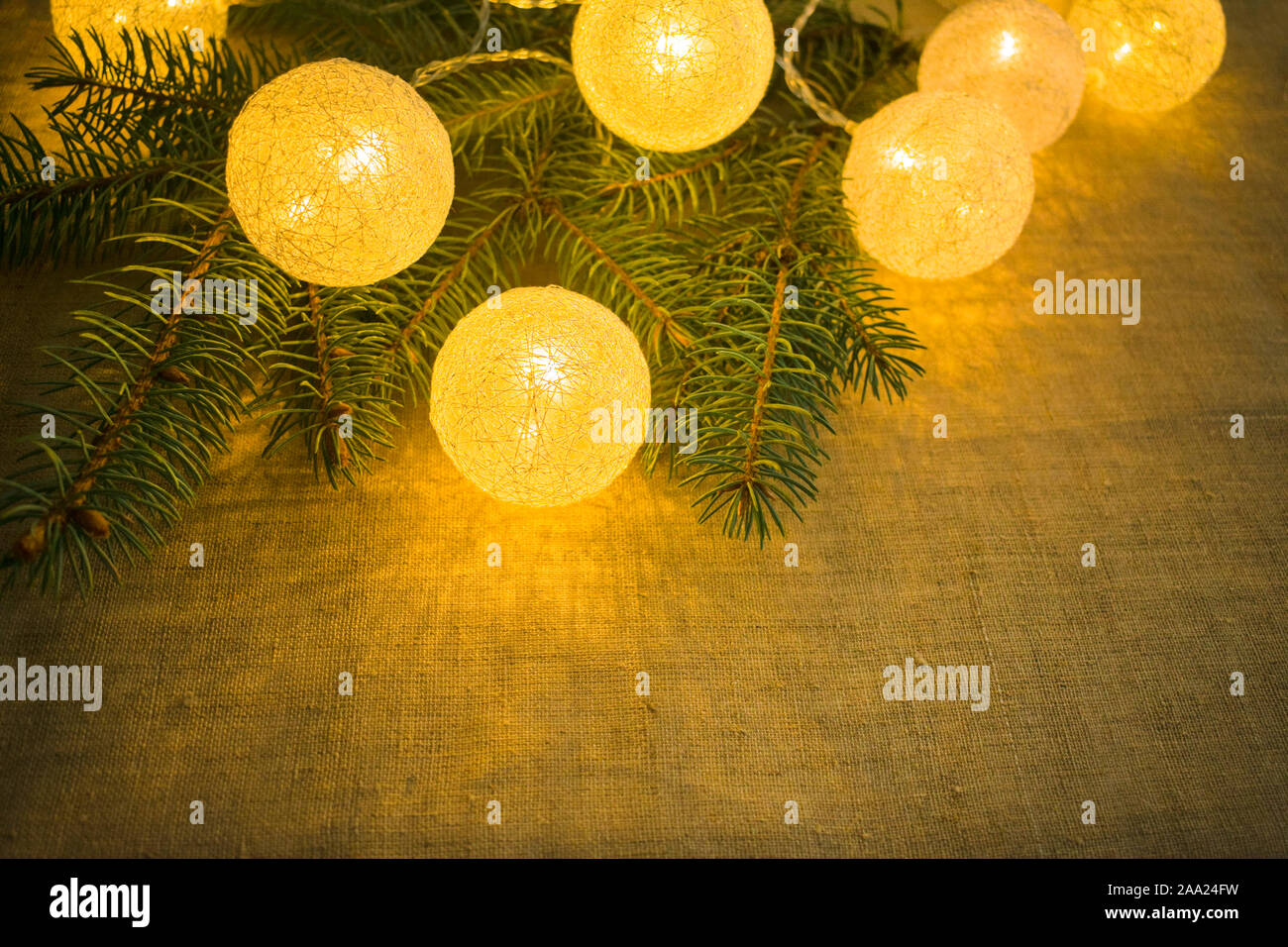 Christmas background of fir branches and luminous balls Stock Photo - Alamy
