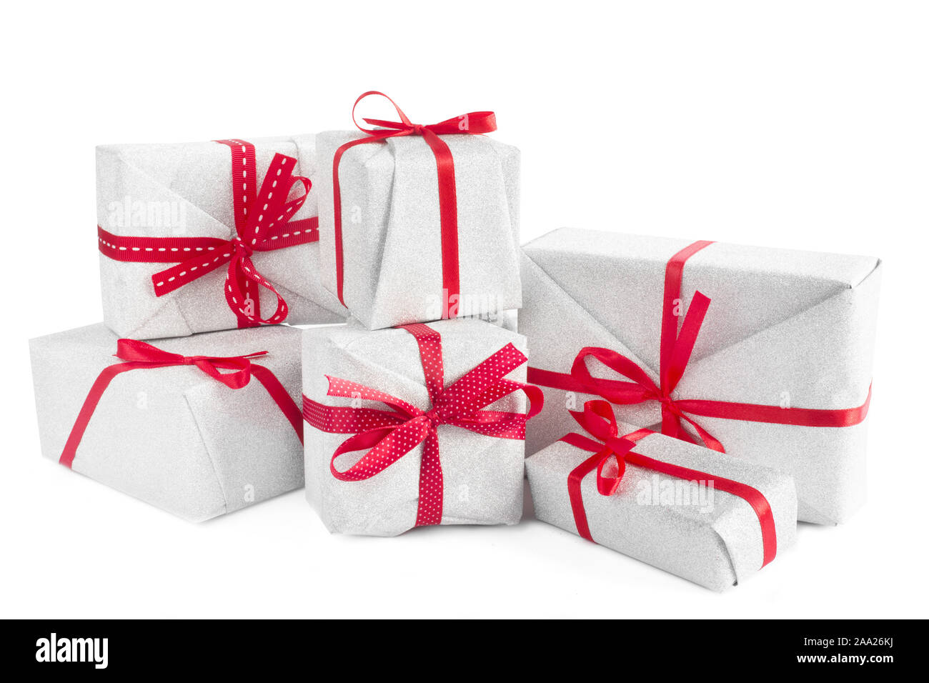 Heap of similar Christmas silver gift boxes with red ribbon decor