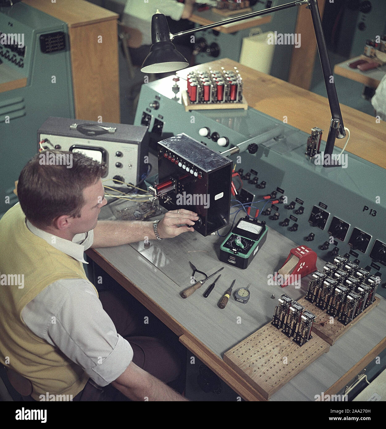 Technology of the 1960s. A man in front of his work at the company Asea in  Västerås. At this time Asea was involved in resarch and development within  the areas of nucelar