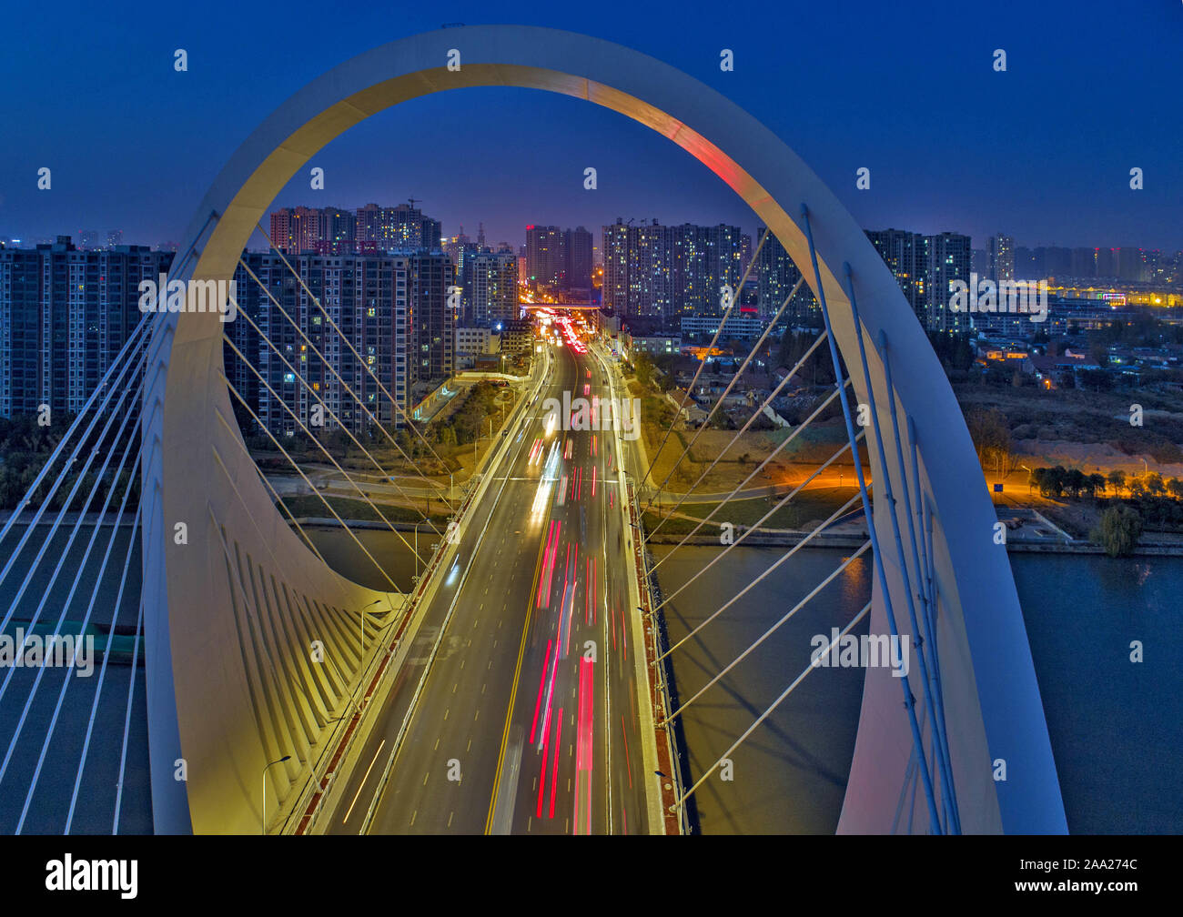 Jiangsu, Jiangsu, China. 19th Nov, 2019. Jiangsu, CHINA-Aerial photo taken on Nov. 15, 2019 shows the Huaihai south road bridge section of Beijing-Hangzhou grand canal at dusk in Huai 'an city, east China's Jiangsu province. Credit: SIPA Asia/ZUMA Wire/Alamy Live News Stock Photo