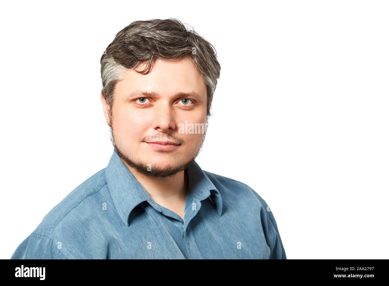 Handsome caucasian man smiling portrait on white isolated background with blue shirt. Stock Photo