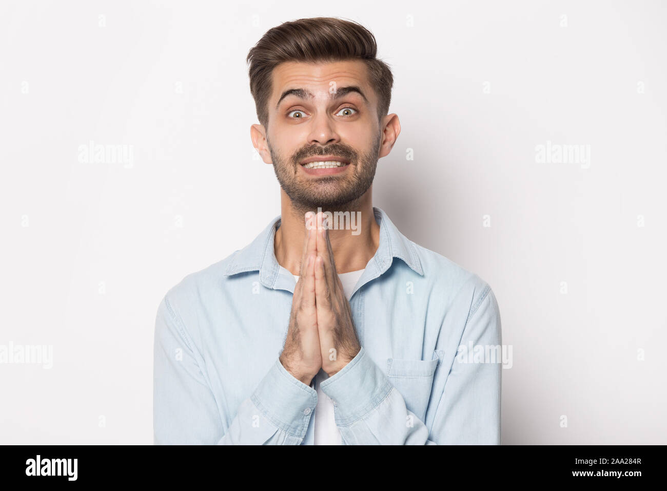 Close up portrait with smiling cunning bearded man begs. Stock Photo