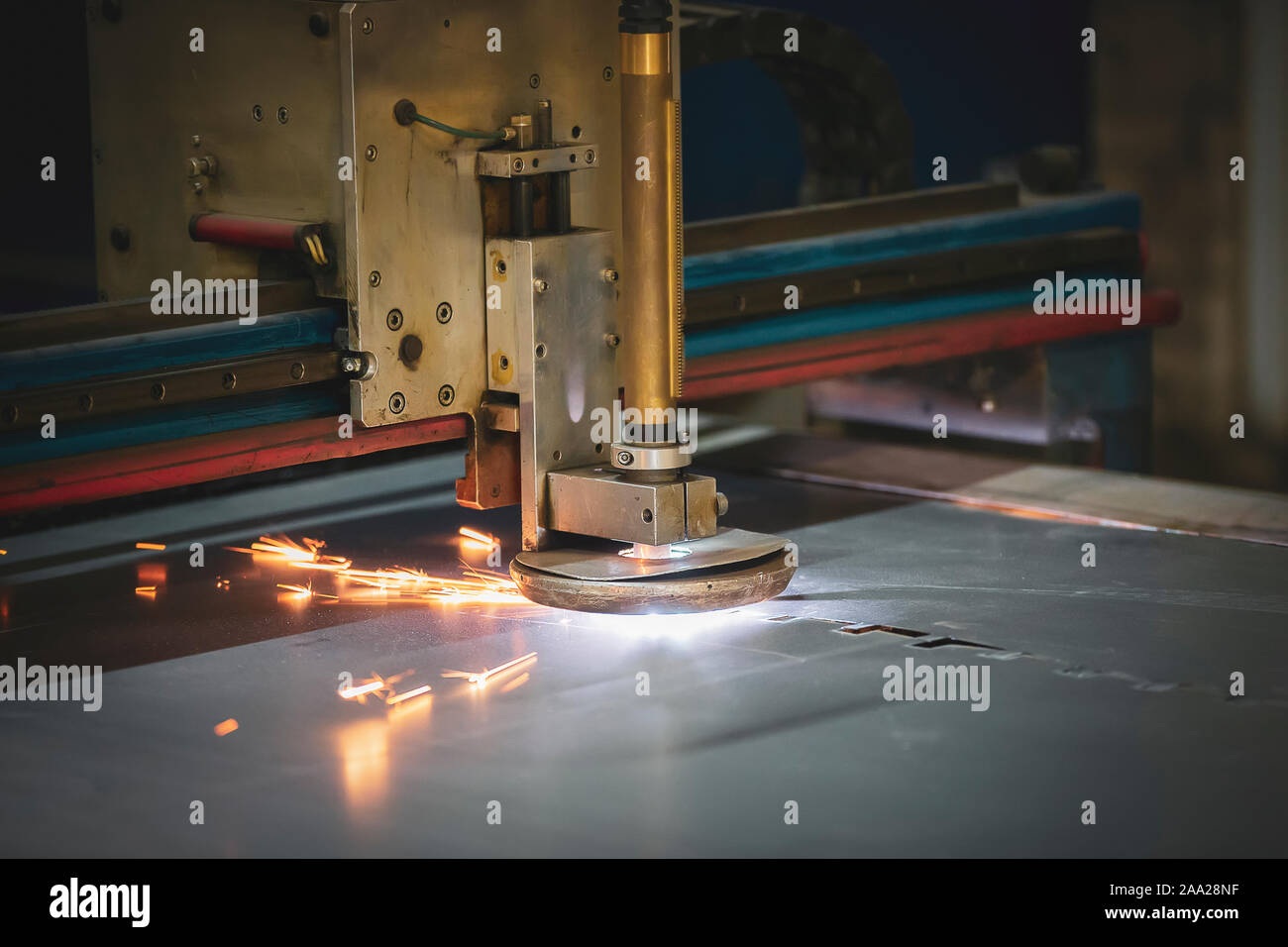 Plasma cutting of metal.The machine cuts iron with sparks.Industrial