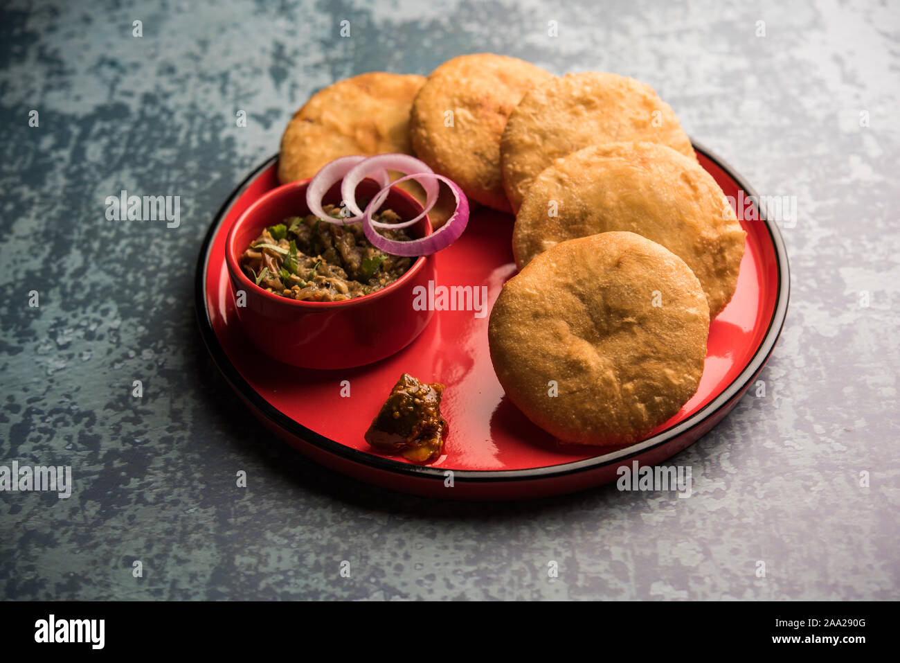 Fried Sattu Litti chokha served with Baingan Bharta, onion and pickle
