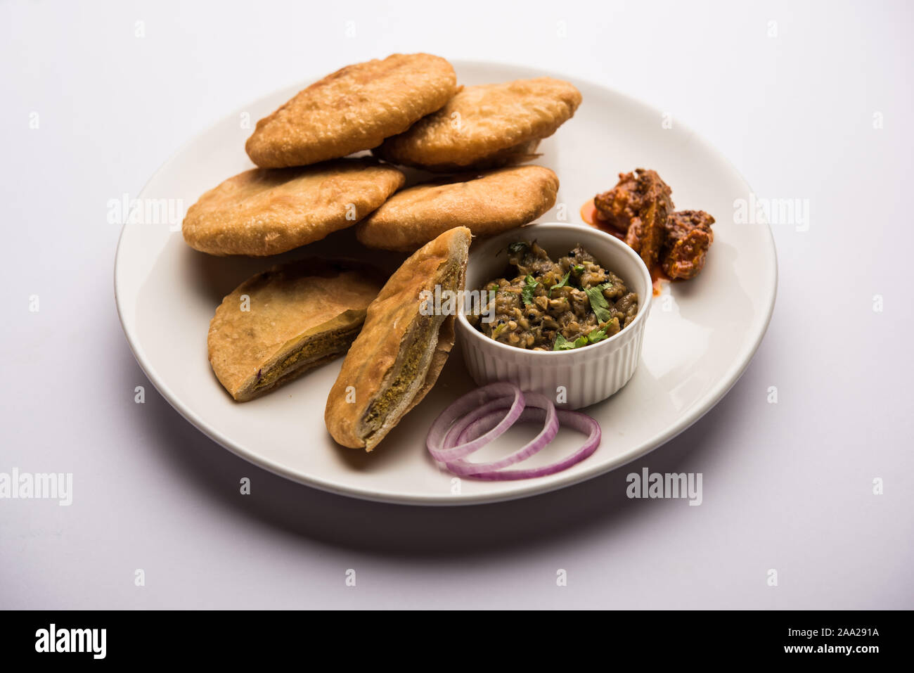 Fried Sattu Litti chokha served with Baingan Bharta, onion and pickle